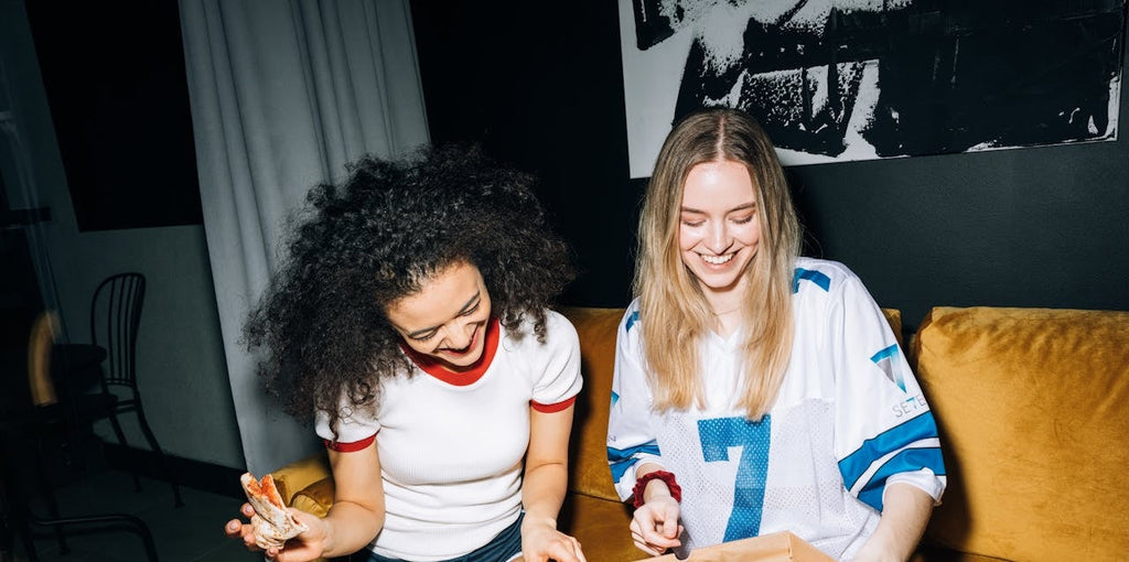 Two women partying in casual New Year's Eve outfits 