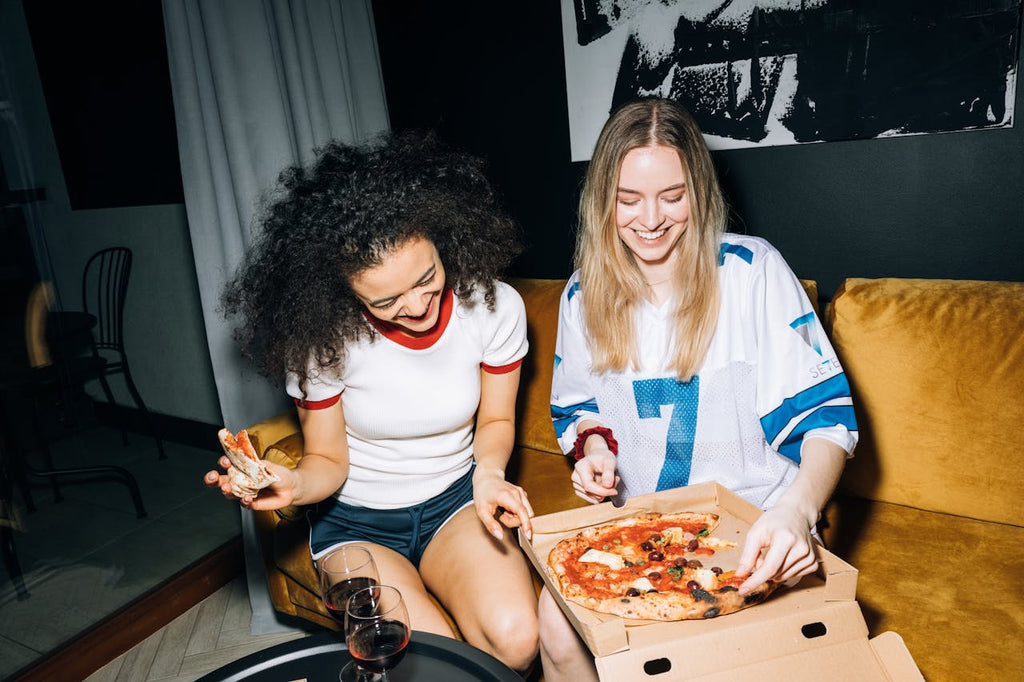Two women partying in casual New Year's Eve outfits 