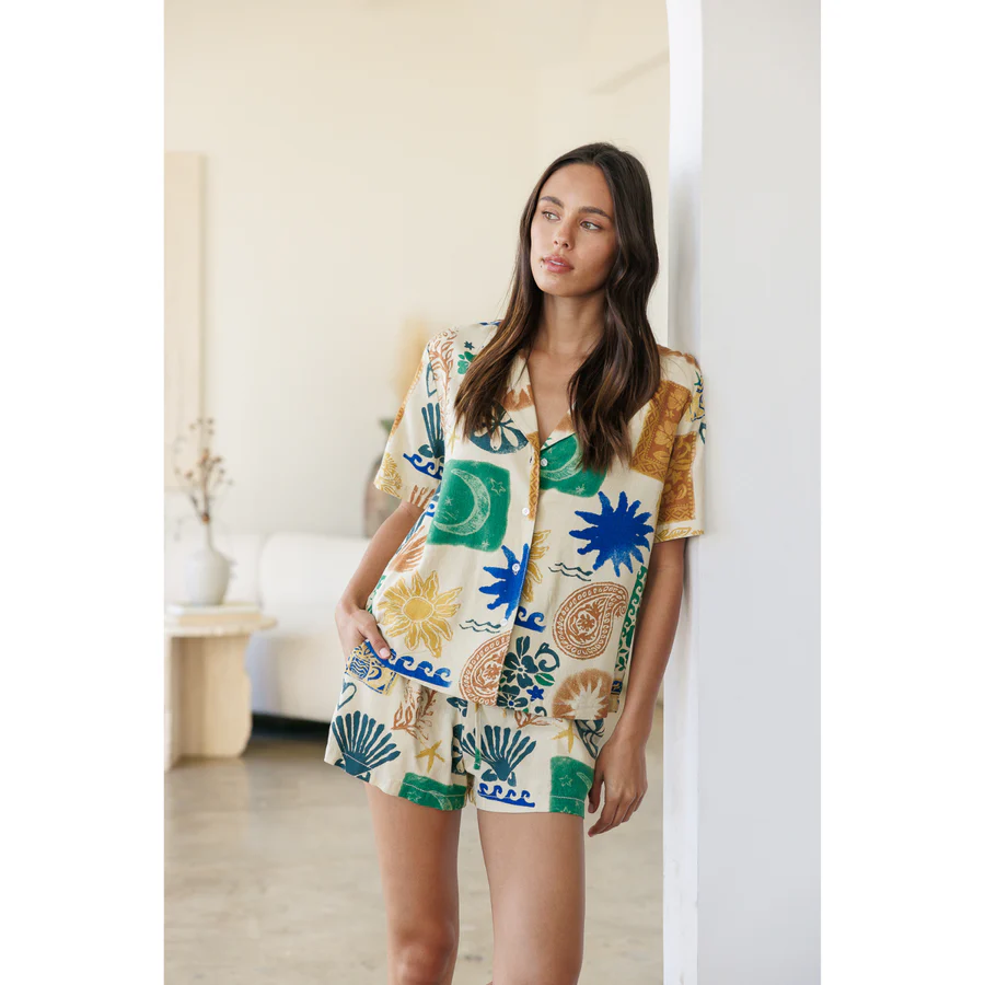 A woman in a printed linen chic loungewear set