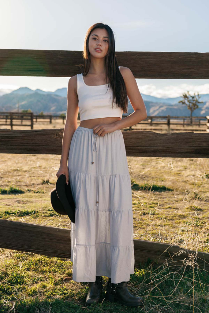 Woman on a ranch in coastal cowgirl clothing