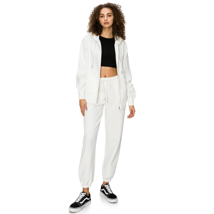 A woman wearing Cali1850 comfy sweatpants in whisper white