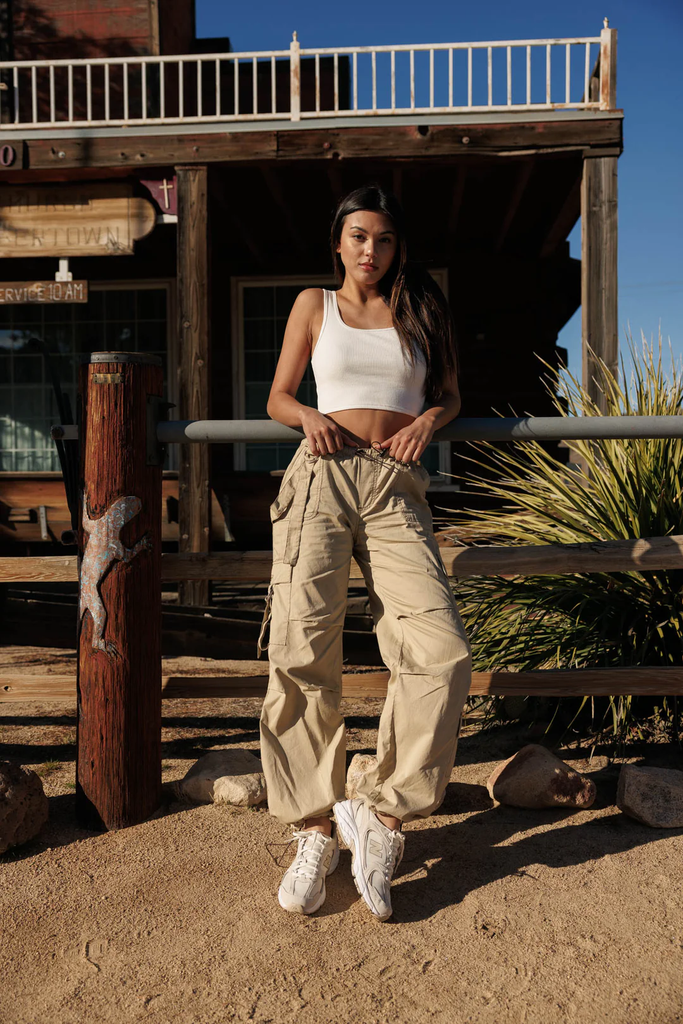 A woman wearing Cali1850 comfy cargo pants in khaki