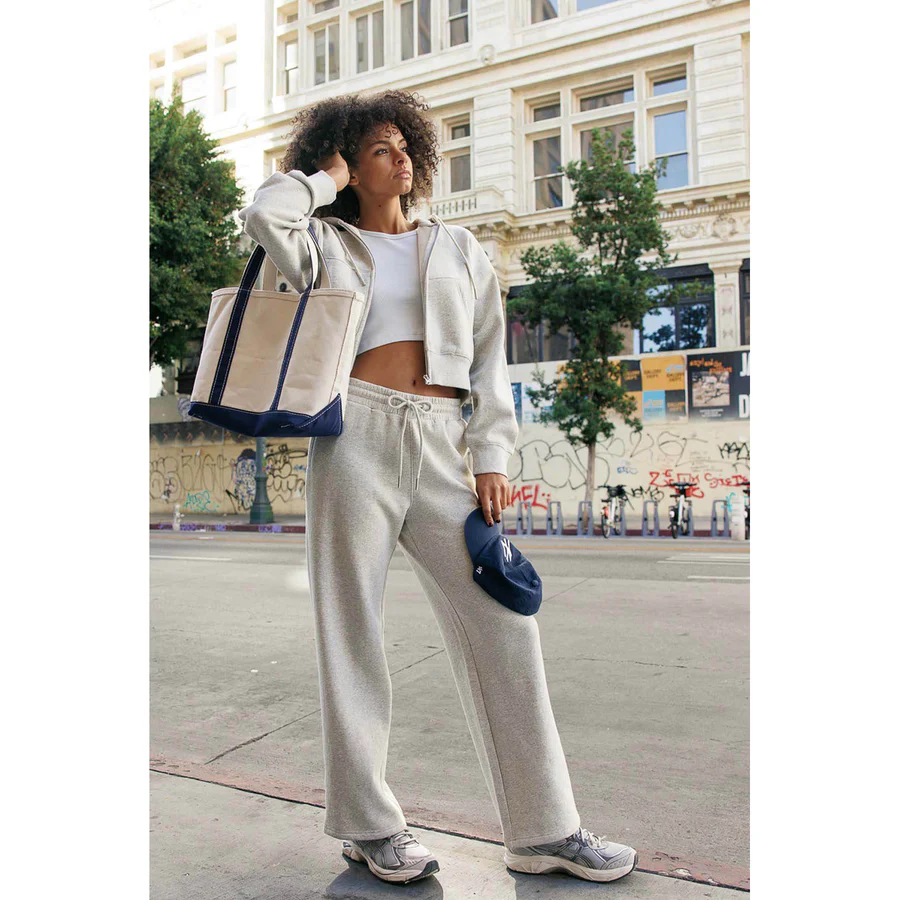 Model wearing a women’s matching sweat set in grey
