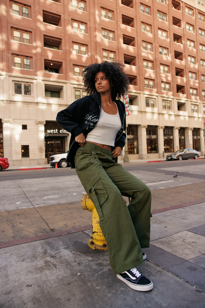 A woman wearing loose cargo pants